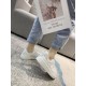 Side profile view of Golden Goose Purestar white leather trainer worn indoors