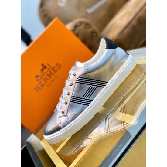 Hermes Avantage Metallic Silver Trainer Display Profile Side perspective view of the silver trainer resting on a glass display surface