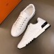 Pair of White Trail Leather Trainers in white and black Angled top view of the pair of white leather trainers placed on a neutral background in white and black