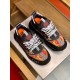 Top view of Versace black and red baroque print trainers showing tongue patches in black and gold