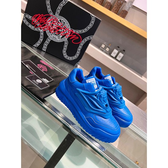 Versace Odissea Blue Leather Trainers Pair Display Pair of blue Versace Odissea leather trainers displayed alongside brand packaging