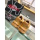 Back view showing embossed heel logo on brown Versace trainers