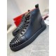 Christian Louboutin Men's Black Spiked High-Top Sneakers Side View Side profile view of Christian Louboutin Men's Black Leather Spiked High-Top Sneakers showing black rubber midsole