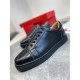 Christian Louboutin Louis Junior Flat Black Leather Trainer Profile Side profile perspective of Christian Louboutin Louis Junior Flat black leather trainer against a neutral backdrop