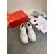 Christian Louboutin Louis Junior Flat White Leather Trainers with Packaging Christian Louboutin Louis Junior Flat white leather trainers displayed with red box and accessories