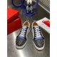 Christian Louboutin Louis Junior Spikes Orlato Front Top View in white and blue Front aerial view of Christian Louboutin Louis Junior Spikes Orlato trainers showing white laces and spiked toe box in white and blue