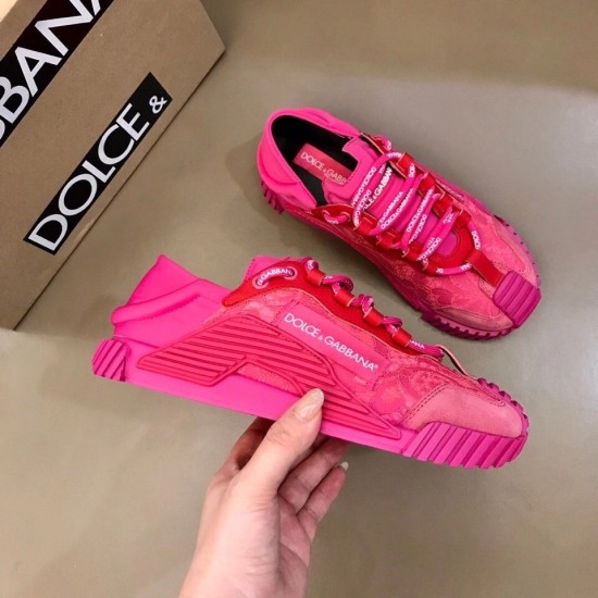 Pair of fuchsia pink lace slip-on trainers next to a shoe box