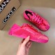 Pair of fuchsia pink lace slip-on trainers next to a shoe box