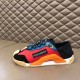 Dolce & Gabbana Red Mesh Trainer Side View Lateral side view of Dolce & Gabbana red mesh trainer with orange accents