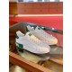 Dolce & Gabbana Portofino White Trainers Side Profile Pair in white and green Pair of white leather Portofino trainers with red stitching and green accents on glass table