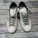 Golden Goose Super-Star Trainers - Pair Overhead View in white and grey Top-down view of a pair of Golden Goose Super-Star white leather trainers on wooden flooring in white and grey