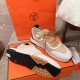 Hermes Addict Knit Trainers Pair with Sole View in beige and white Pair of Hermes Addict Knit Trainers displayed on box showing the upper and treaded sole in beige and white