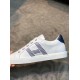Hermes Avantage Leather Trainers Side Profile in white and blue Side profile of white leather trainer featuring blue striped side accent