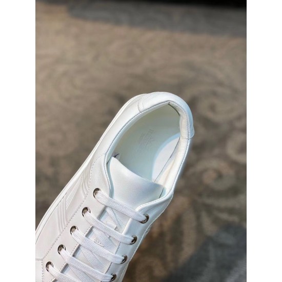 Close-up top view of collar, lacing and eyelets on white leather trainer
