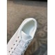 Close-up top view of collar, lacing and eyelets on white leather trainer