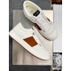 Jimmy Choo Leather Low Top Trainers White Brown Side Profile Jimmy Choo Leather Low Top Trainers White Brown resting side profile pair view