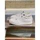 Jimmy Choo Hawaii White Trainer Side Profile Side profile of Jimmy Choo Hawaii white leather trainer on metal display platform