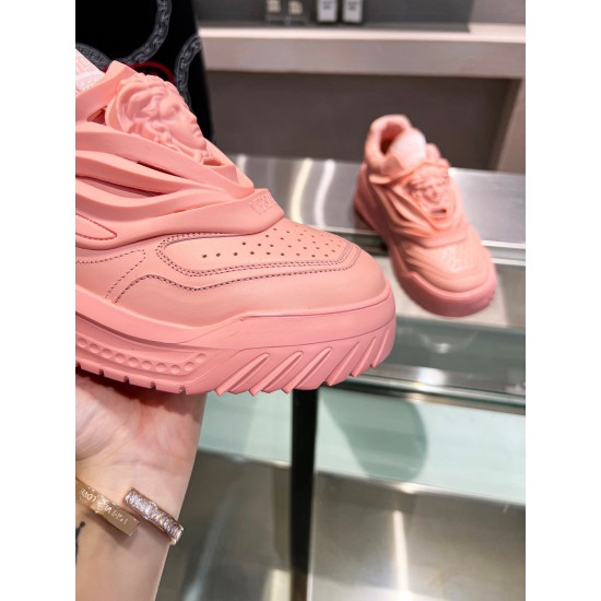 Close-up of the perforated toe cap and front rubber sole on the pink Versace Odissea leather trainer