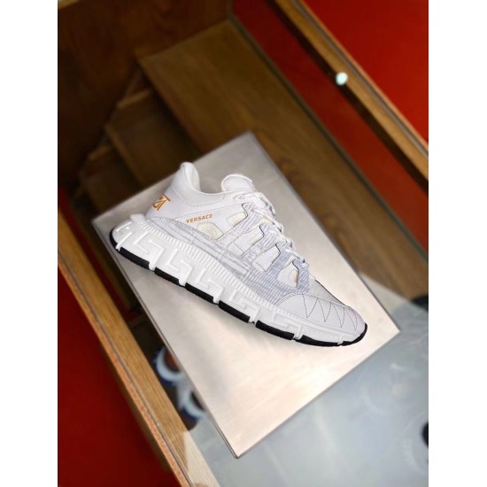 Versace Trigreca Low Top White Trainer Profile View in white and gold Side profile of single Versace Trigreca Low Top White Trainer resting on display stand in white and gold