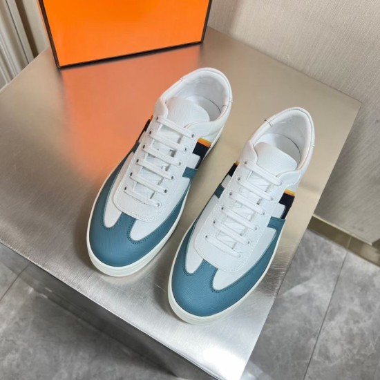 Top-down view of Hermes Boomerang white and blue leather trainers pair