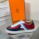 Profile view of the inner side of Hermes Boomerang multicolour leather trainer