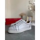 Side profile of Christian Louboutin white spiked leather low-top trainers in white and silver