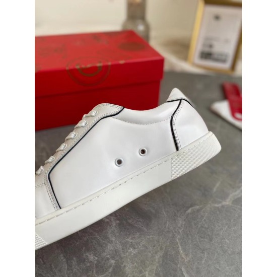 Close-up side profile of Christian Louboutin Vieirissima white leather trainer detailing lateral ventilation eyelets in white and black