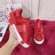 Dolce & Gabbana Custom 2.Zero Red Trainer Side Profile View Hand holding Dolce & Gabbana Custom 2.Zero red trainer showing lateral side profile