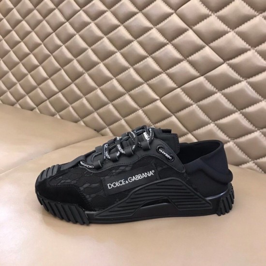Dolce & Gabbana Black Lace Low Top Slip On Trainers Lateral Profile Dolce & Gabbana Black Lace Low Top Slip On Trainers lateral side view on leather surface