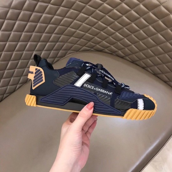 Side Profile Dolce & Gabbana Blue Trainer Side profile view of Dolce & Gabbana blue trainer held in hand showing lateral logo