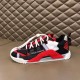 Dolce & Gabbana Red Trainer Lateral Profile Dolce & Gabbana red fabric trainer side profile on surface