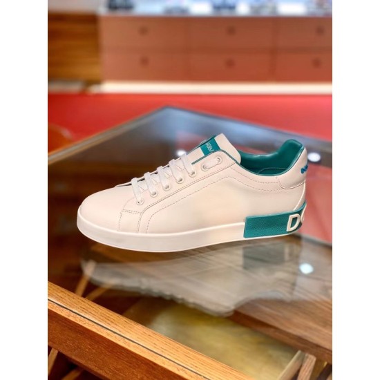 Dolce & Gabbana Portofino Trainer Side View in white and blue Side profile of white Dolce & Gabbana Portofino Leather Trainer with azure accents in white and blue