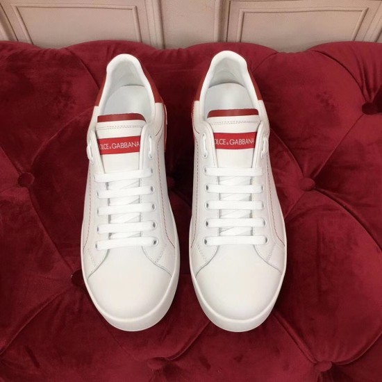 Dolce & Gabbana Portofino Leather Trainers Top View in white and red Top-down view of a pair of Dolce & Gabbana white leather trainers with red branded tongue labels