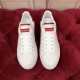 Dolce & Gabbana Portofino Leather Trainers Top View in white and red Top-down view of a pair of Dolce & Gabbana white leather trainers with red branded tongue labels