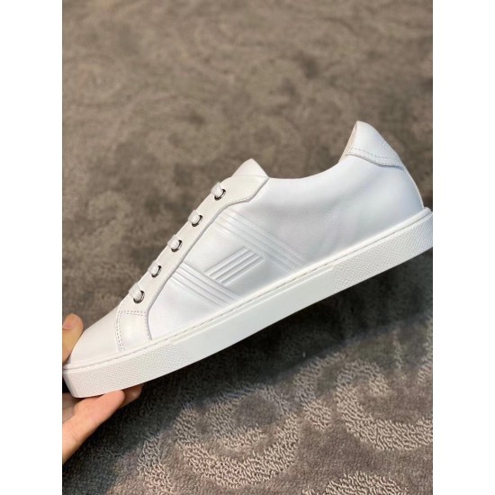 Medial side view of the Hermes Avantage white leather trainer