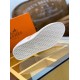 Outsole Tread View of White Leather Trainer in white and orange Underside view of white textured rubber tread sole with brand logo stamping in white and orange