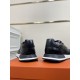 Hermes Drive Leather Low Top Trainers Black Heel View in black and white Rear view of both heel counters on Hermes Drive Leather Low Top Trainers Black in black and white