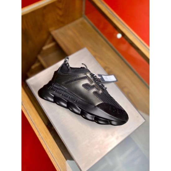Versace Chain Reaction Black Trainers Profile Versace Chain Reaction black trainers resting on display stand angled view