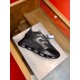 Versace Chain Reaction Black Trainers Profile Versace Chain Reaction black trainers resting on display stand angled view