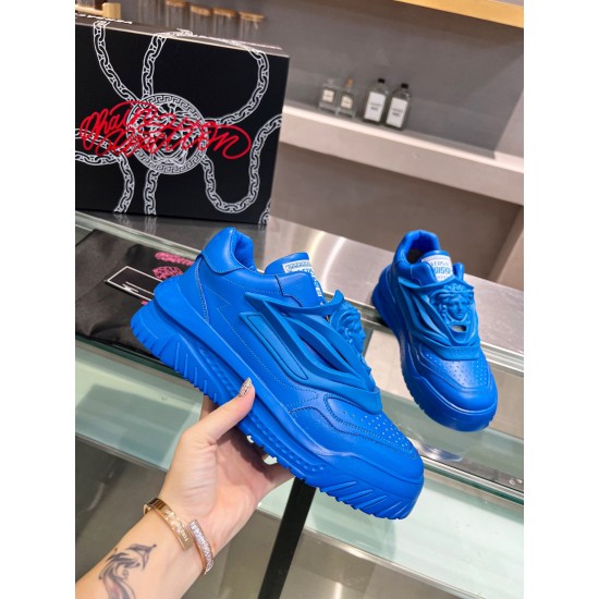 Versace Odissea Blue Leather Trainer Side Profile Hand holding a blue Versace Odissea trainer demonstrating the chunky platform sole