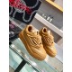 Three-quarter angled view of brown leather Versace Odissea trainers