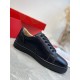 Christian Louboutin Louis Junior Flat Black Leather Trainer Side View Side profile of a Christian Louboutin Louis Junior Flat black leather low top trainer displaying ventilation eyelets and midsole
