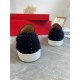 Rear view of Christian Louboutin Pik Boat Flat black trainers showing heel spike detail and white soles