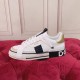 Dolce & Gabbana Custom 2.Zero Trainers Side Profile in white and black Side profile of white Dolce & Gabbana Custom 2.Zero trainers on a plush surface in white and black