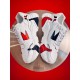 Dolce & Gabbana White Leather Trainers Side Profile Side profile of Dolce & Gabbana white leather trainers with red graphics