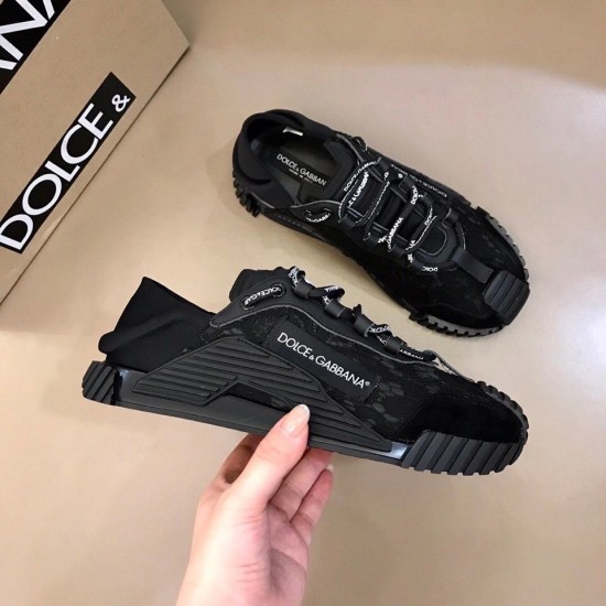 Dolce & Gabbana Black Lace Low Top Slip On Trainers Side Profile Dolce & Gabbana Black Lace Low Top Slip On Trainers held sideways with branded shoebox