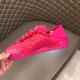 Side profile of a single Dolce & Gabbana fuchsia pink lace trainer showing the ridged midsole