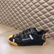 Side profile of Dolce & Gabbana black fabric trainer with tan heel detail