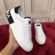 Dolce & Gabbana Portofino trainer held showing side and heel logo in white