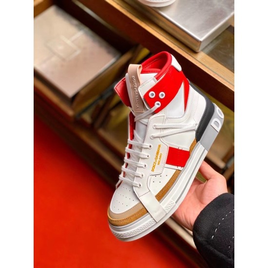 Hand holding a single Dolce & Gabbana Custom 2.Zero white and red high-top trainer showing side profile.